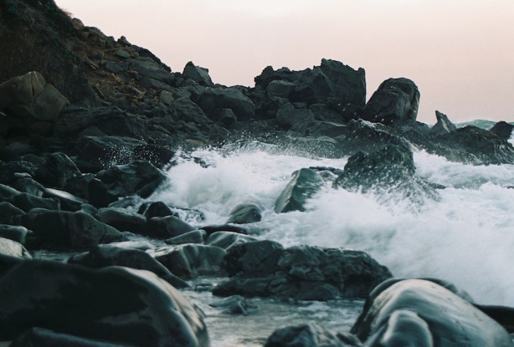 WAVES AGAINST ROCKS